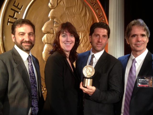 Filmmakers Rich Garella, Jeffrey Saunders, and Bradley Cox, with Lois Vossen of ITVS, at The Waldorf Astoria New York, with the Peabody Award they received for Who Killed Chea Vichea?